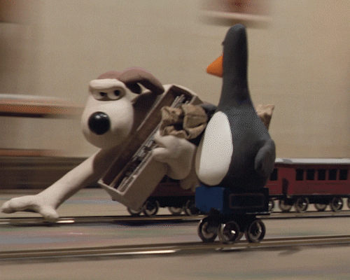 Gromit laying tracks for a model train